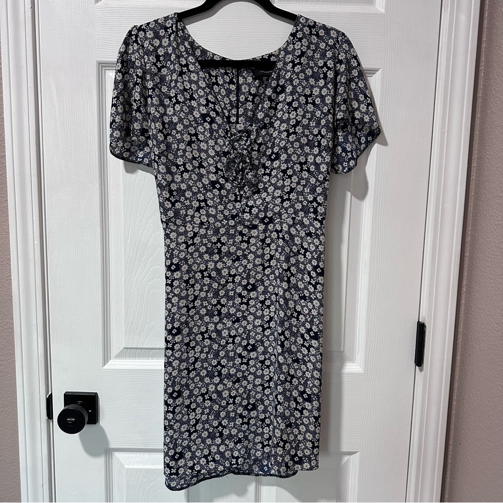 Navy dress with white flowers and lace front detail